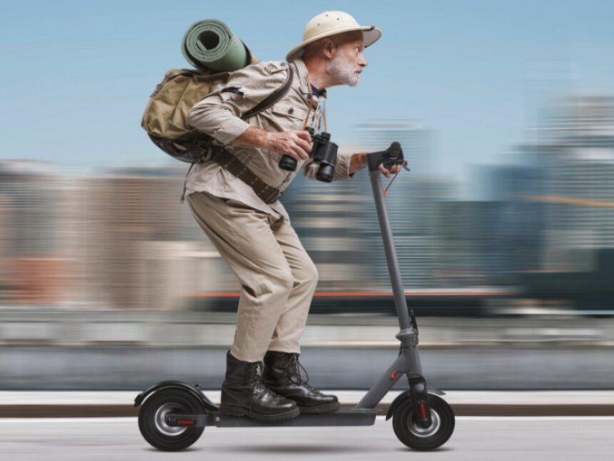 Funny,Senior,Urban,Explorer,Riding,A,Fast,Electric,Scooter,In